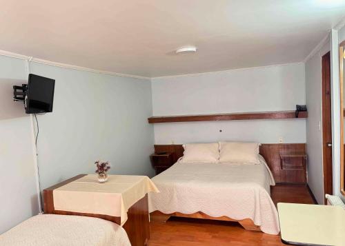 Ein Bett oder Betten in einem Zimmer der Unterkunft Hotel Montecarlo Pichilemu