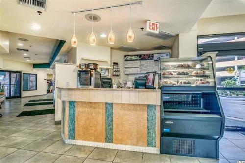 a fast food restaurant with a counter with food at WINTER RATES! Captivating Coastal Charm - Oceanview Suite! PG 504 in Myrtle Beach