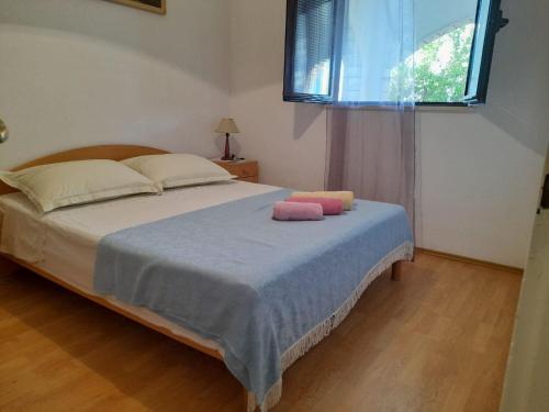 Postel nebo postele na pokoji v ubytování Apartments Jere