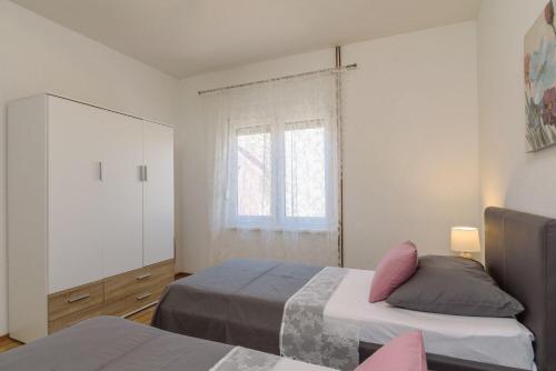 Posteľ alebo postele v izbe v ubytovaní Apartment Vana