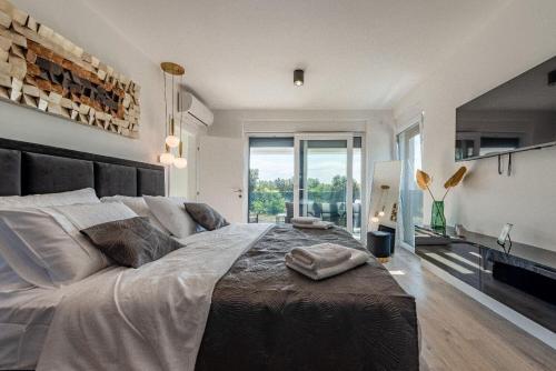 Katil atau katil-katil dalam bilik di Villa Ren