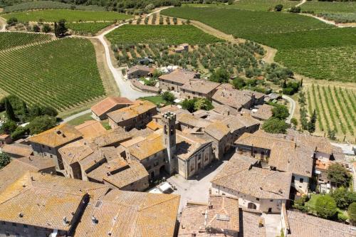 an aerial view of a village with houses and trees at Casa Matilde Chianti - Jeky Stay in Castelnuovo Berardenga