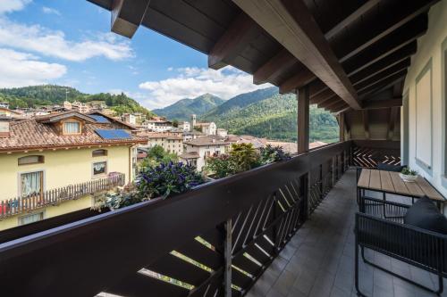 a balcony with a view of the mountains at Green Hotel Genzianella in Roncone