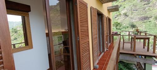 a view from the hallway of a house with a balcony at Casa Cavoquinho in Paul