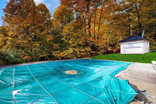 a blue tarp that is on top of a driveway at Mountainside 35 in Warren