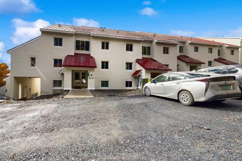 a white car parked in front of a building at Mountainside 35 in Warren