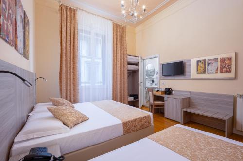 Ένα ή περισσότερα κρεβάτια σε δωμάτιο στο Lilium Hotel