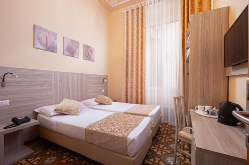 Ένα ή περισσότερα κρεβάτια σε δωμάτιο στο Lilium Hotel