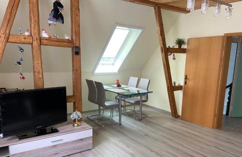 TV a/nebo společenská místnost v ubytování Ferienhaus Schuster