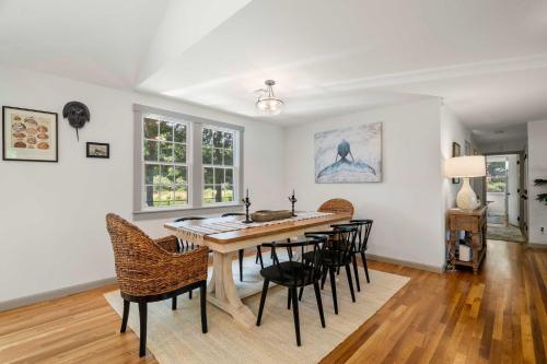 a dining room with a table and chairs at Newly Updated Home Close to Beaches in Eastham