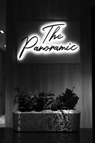 a sign on a wall with a potted plant at Idou Anfa Hôtel & Spa in Casablanca
