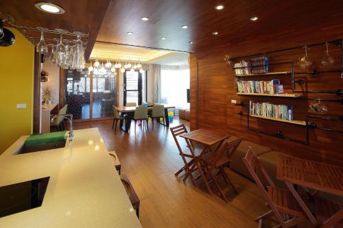 a kitchen and dining room with a table and chairs at Master Homestay in Wujie