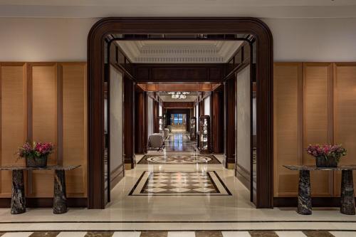 a corridor of a hotel with a hallway at JW Marriott Essex House New York in New York