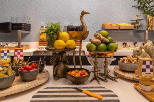 a display of fruits and vegetables on a counter at Van Der Valk Hotel Brugge Oostkamp in Oostkamp