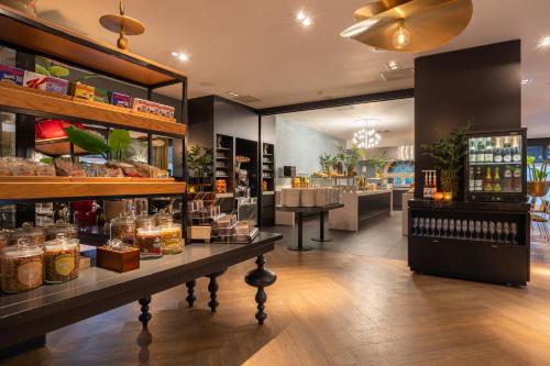 a store with a lot of products on display at Van Der Valk Hotel Brugge Oostkamp in Oostkamp