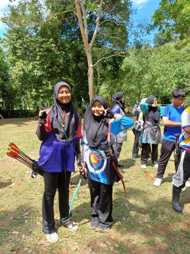 a group of people standing in the grass at Lemuni Retreat & Training Centre - Kerling, Selangor in Kerling