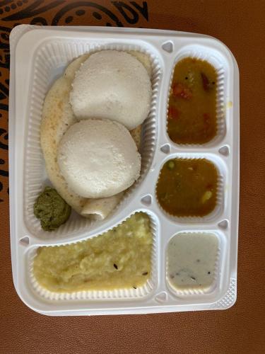 a plastic container filled with different types of food at Philomena Hotel & Apartment in Thanjāvūr