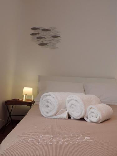 a bed with towels on top of it at Le Casasse Ca' Parodi 7 in Varigotti