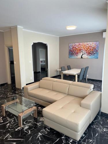 a living room with a couch and a table at Hotel Lis in Asti