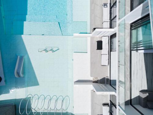 a building with blue and white tile on the side of it at Beach Walk Condo 3br in Replay in Bang Rak Beach