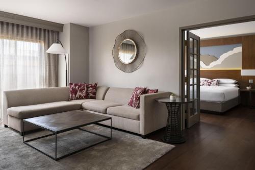 a living room with a couch and a bed at Napa Valley Marriott Hotel & Spa in Napa