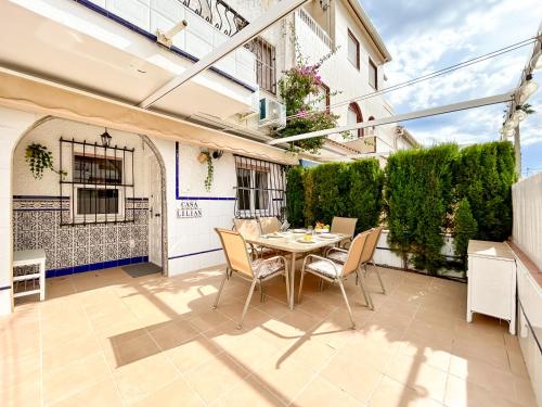 an outdoor patio with a table and chairs at Stay In Calm Beach in Santa Pola