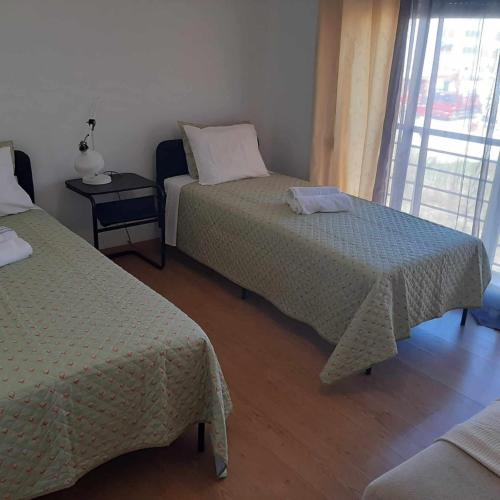 Ένα ή περισσότερα κρεβάτια σε δωμάτιο στο Lisbon room