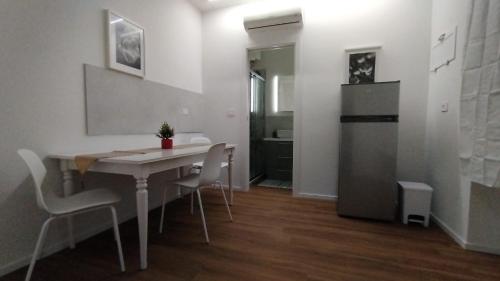 a kitchen and dining room with a table and chairs at Dreaming Ortona in Ortona