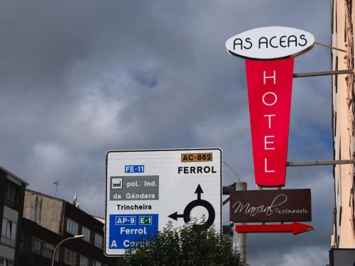 a sign for a gas station on a street at Hotel As Aceas in Narón