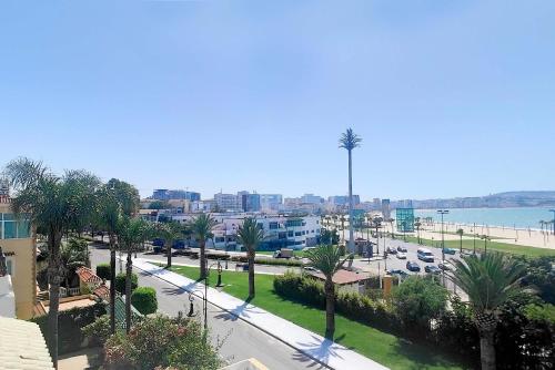 a view of a city with palm trees and a street at Villa Mirasol Hotel in Tangier