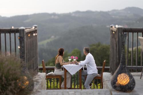 a man and a woman sitting at a table at Jaglhof in Gamlitz