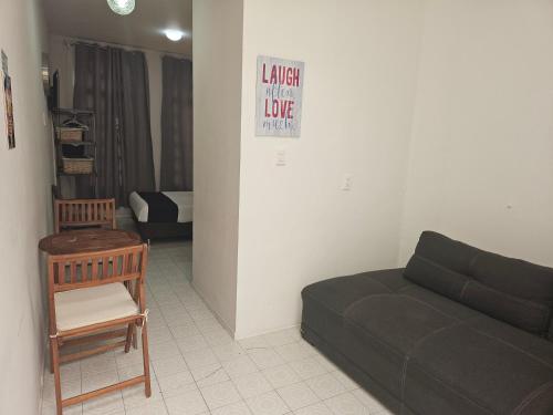 a living room with a couch and a chair at Singular Coyoacán Pepper My Love! in Mexico City