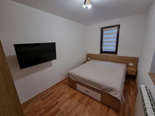 Postel nebo postele na pokoji v ubytování HedoNik Divčibare