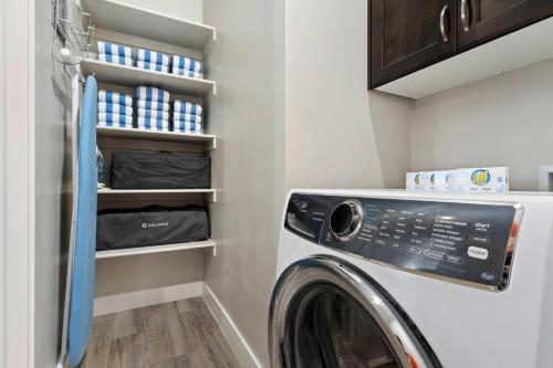 a laundry room with a washer and dryer at 30-31| 2 Homes in St George with Private Pools and Hot Tubs in Santa Clara