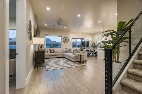 a living room with a couch and a table at 30-31| 2 Homes in St George with Private Pools and Hot Tubs in Santa Clara