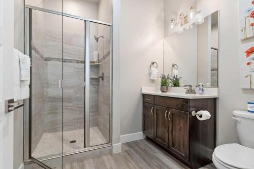a bathroom with a shower with a sink and a toilet at 30-31| 2 Homes in St George with Private Pools and Hot Tubs in Santa Clara