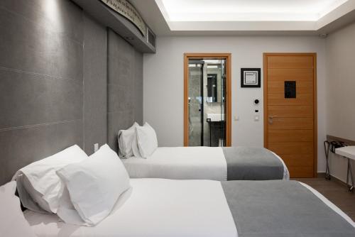 Postel nebo postele na pokoji v ubytování Kastro Hotel