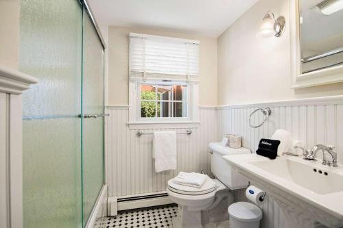 a bathroom with a toilet and a sink and a shower at Located on Rail Trail By Beach & Downtown in Chatham