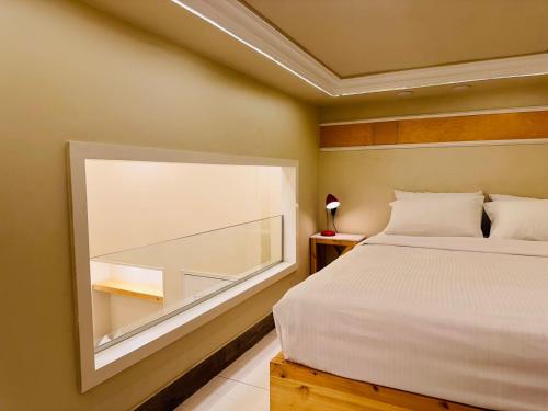 Postel nebo postele na pokoji v ubytování Paris Hotel Cairo