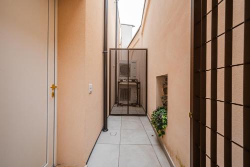 an empty corridor of a building with a hallway at Loft Il Moro 2 Maranello Sassuolo Free Netflix & wi-fi in Casalgrande
