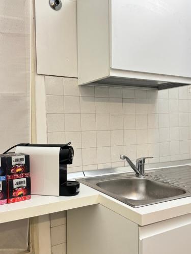 a kitchen counter with a sink and a mixer at Urban Oasis in Front of Duomo di Perugia in Perugia