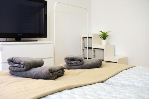Ένα ή περισσότερα κρεβάτια σε δωμάτιο στο Apartament Centrum Rynek
