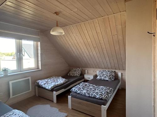 Posteľ alebo postele v izbe v ubytovaní Domek Całoroczny Fuleda -Mazury Giżycko Sauna Jacuzii Kominek