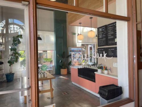 a restaurant with a counter in a room at Chambre de Bonne in Downtown Long Beach in Long Beach