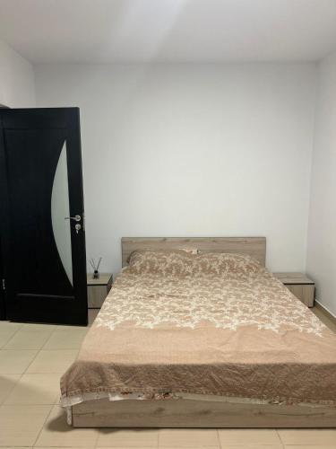 Ένα ή περισσότερα κρεβάτια σε δωμάτιο στο Natalieva Apartment
