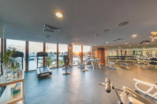 a gym with a lot of treadmills and machines at Villa with 3 bedrooms private pool and ocean view in Santa Bárbara de Samaná