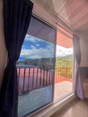 a window with a view of a balcony at Quinta Las Mendoza in Zetaquira