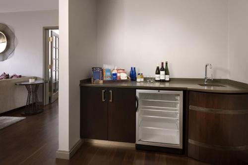 a kitchen with a counter with a sink and a dishwasher at Napa Valley Marriott Hotel & Spa in Napa