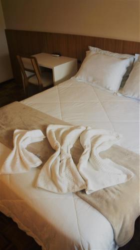 Ένα ή περισσότερα κρεβάτια σε δωμάτιο στο Hotel Mazzuco