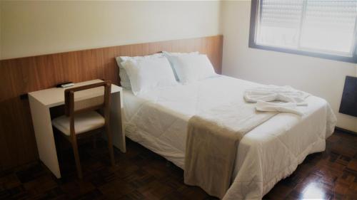 Ένα ή περισσότερα κρεβάτια σε δωμάτιο στο Hotel Mazzuco